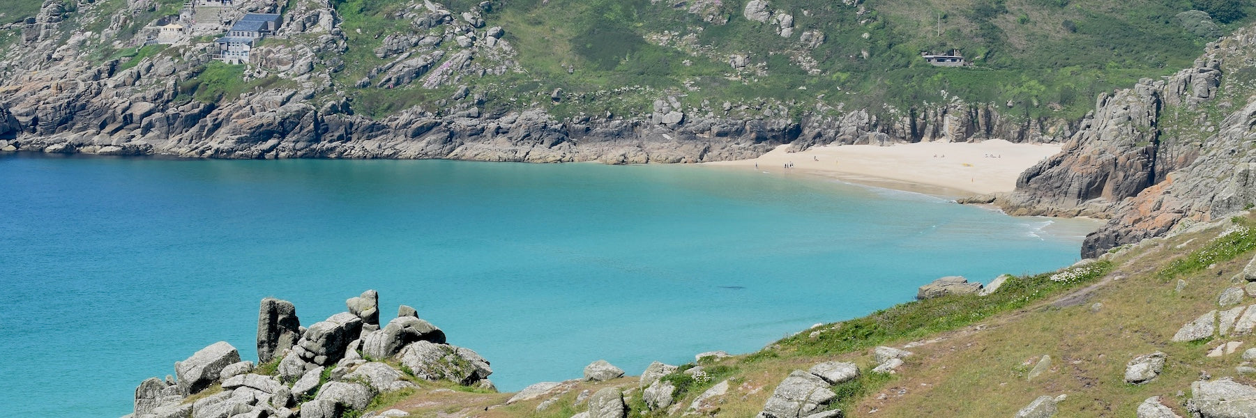 View of Porthcurno and the Minack Theatre, choughs in the foreground
