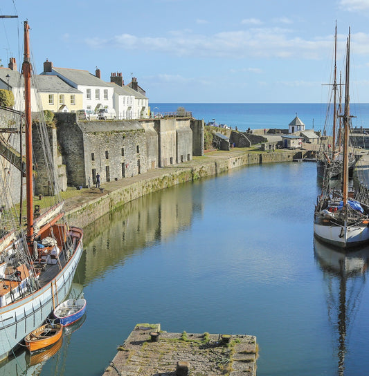 An Evocative Cornwall greetings card showing the historic harbour at Charlestown with its tall ships, on a beautiful day
