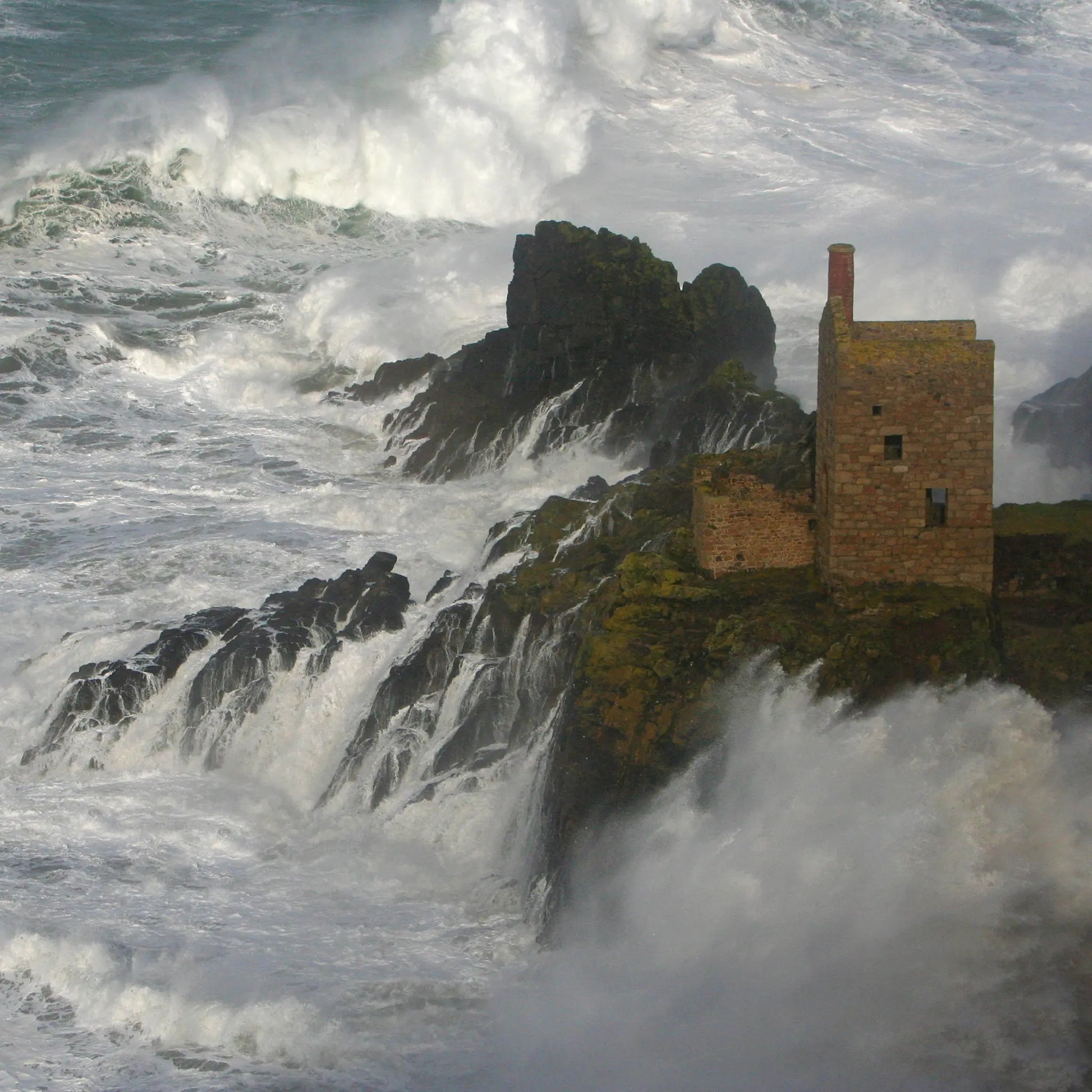 Cornish greetings card image of The Crowns engine houses on rocks at Botallack, amid crashing waves