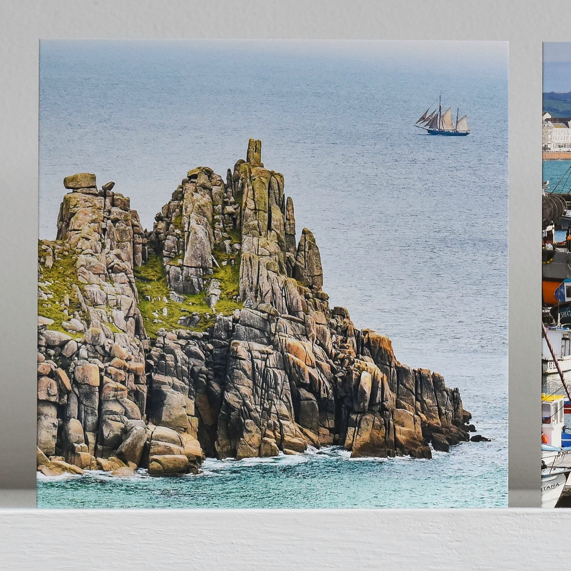 Cornish greetings card showing a pirate ship passing Logan Rock
