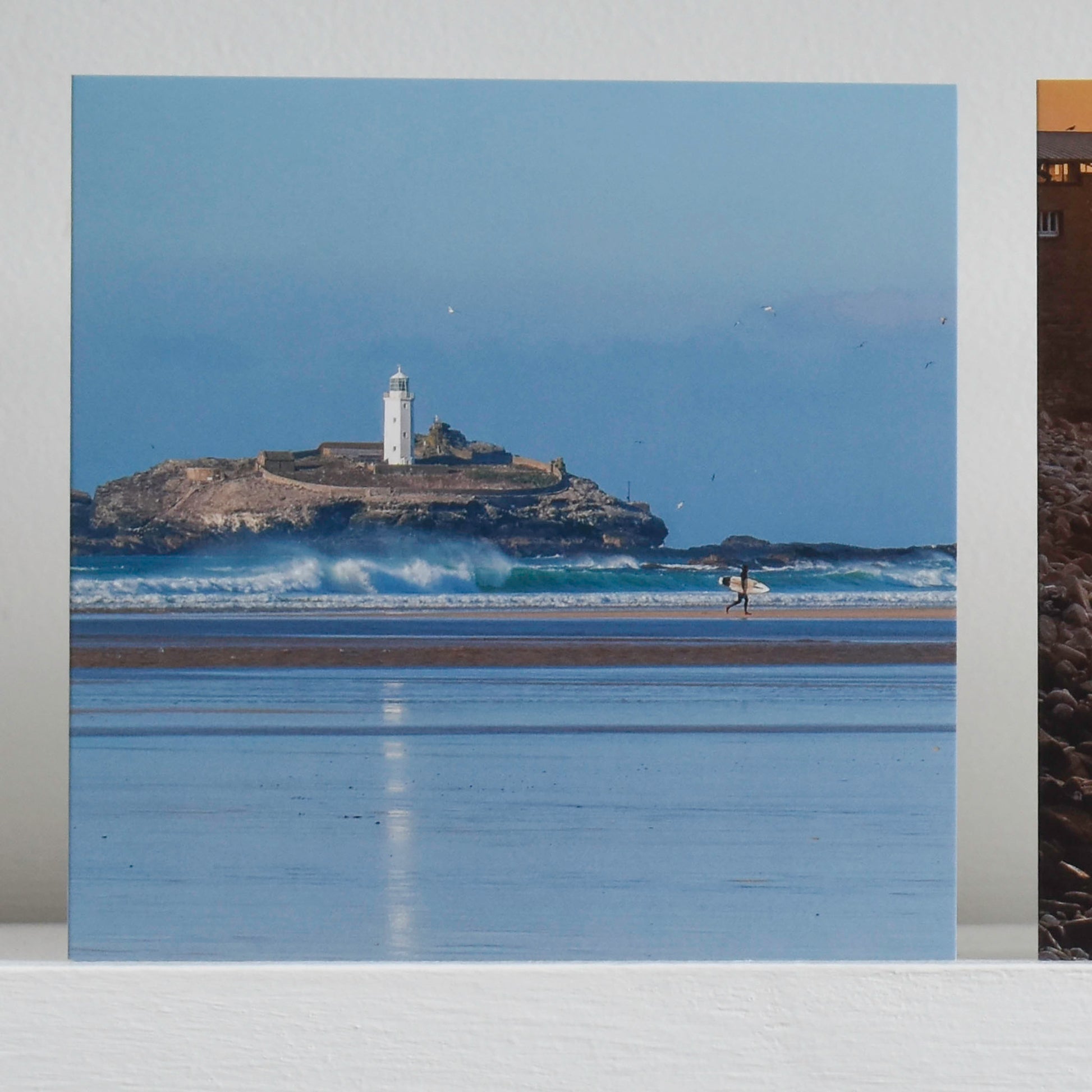 Cornish greetings card showing a surfer leaving the sea at Godrevy