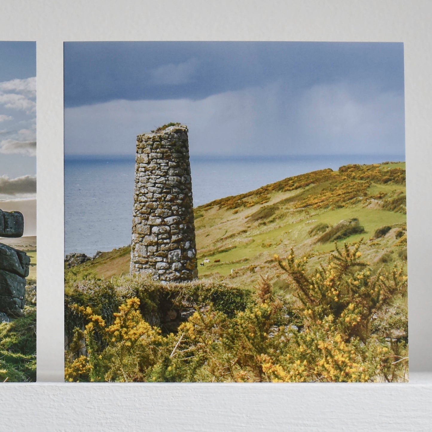 Cornish greetings card with a view of an old mining stack surrounded by flowering gorse with the sea in the background