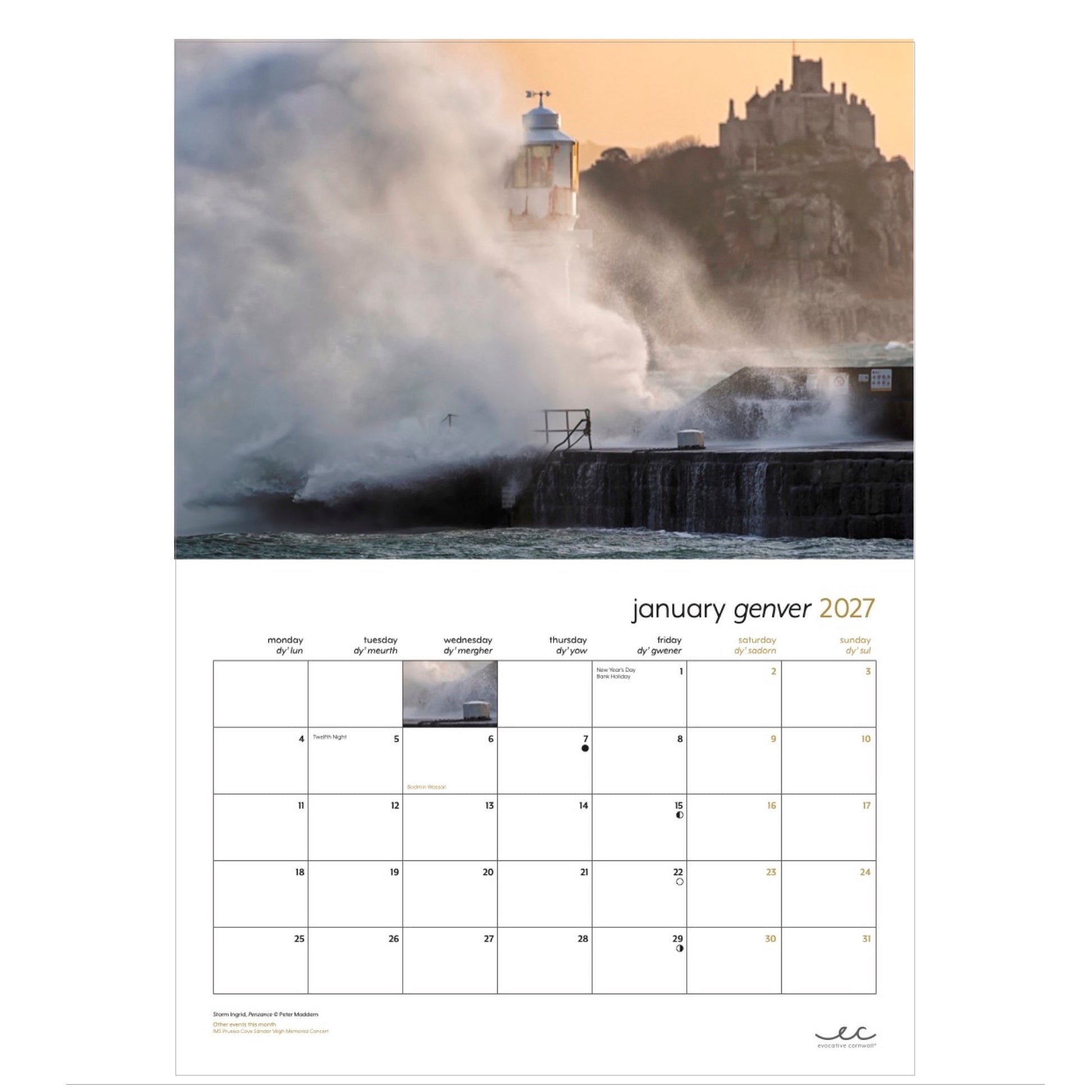 Inside page of calendar for January 2027,  an enormous wave swamps Penzance harbour wall with St Michael's Mount in the distance (image: Peter Maddern)