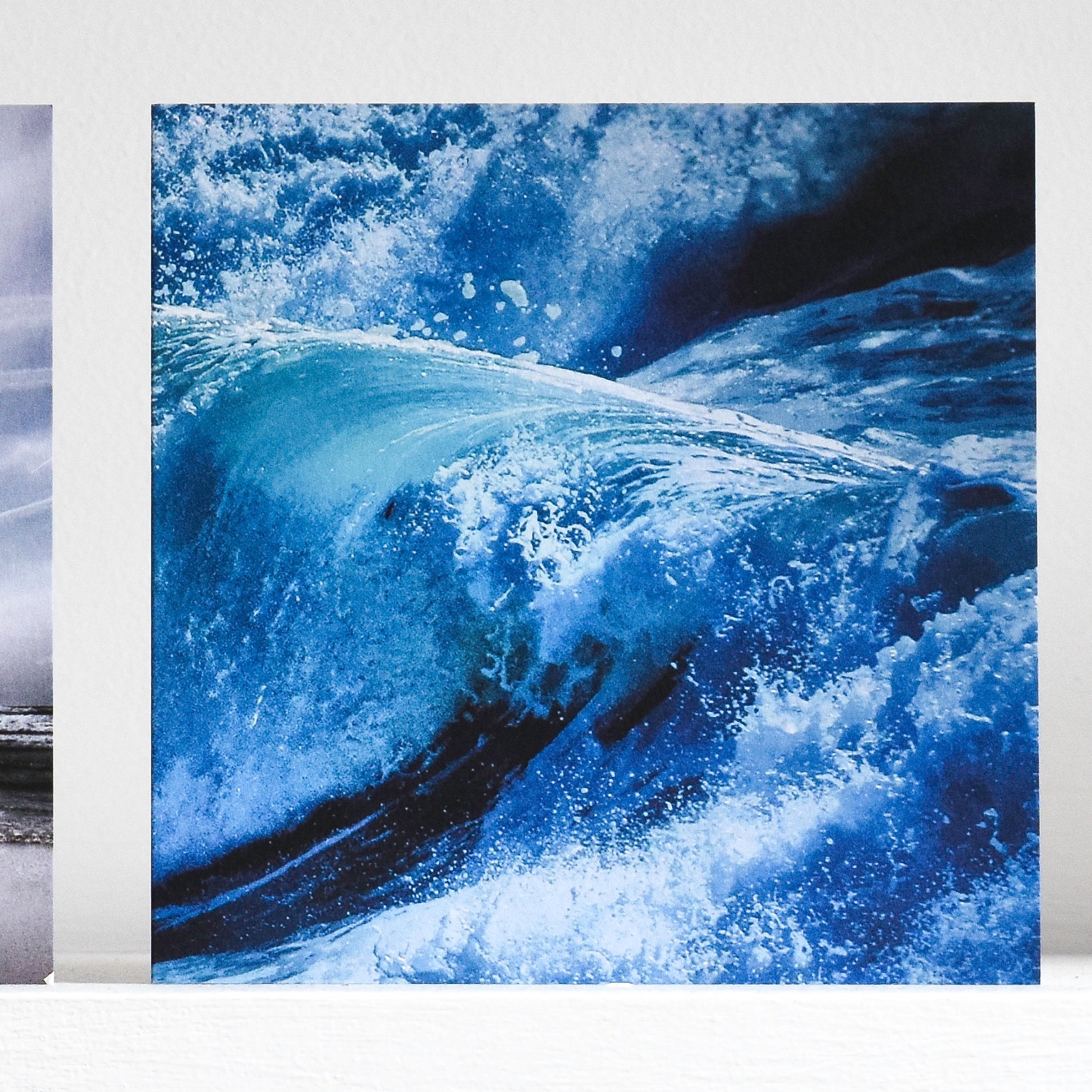 Close up of blue waves greeting card on shelf