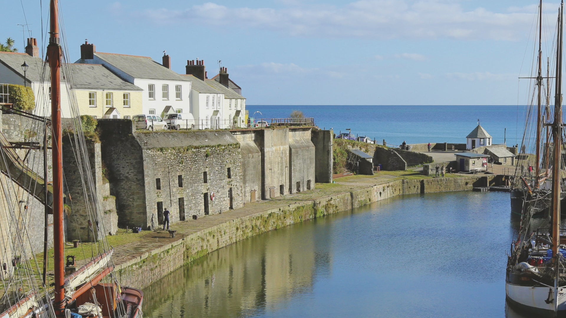 Video animation of greeting card image, showing Charlestown Harbour with 3 tall ships moored up, on a beautiful clear day