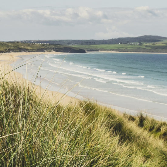 Video animation of greeting card, featuring a path through the sand dunes at Gwithian, the beach and St Ives Bay in the background