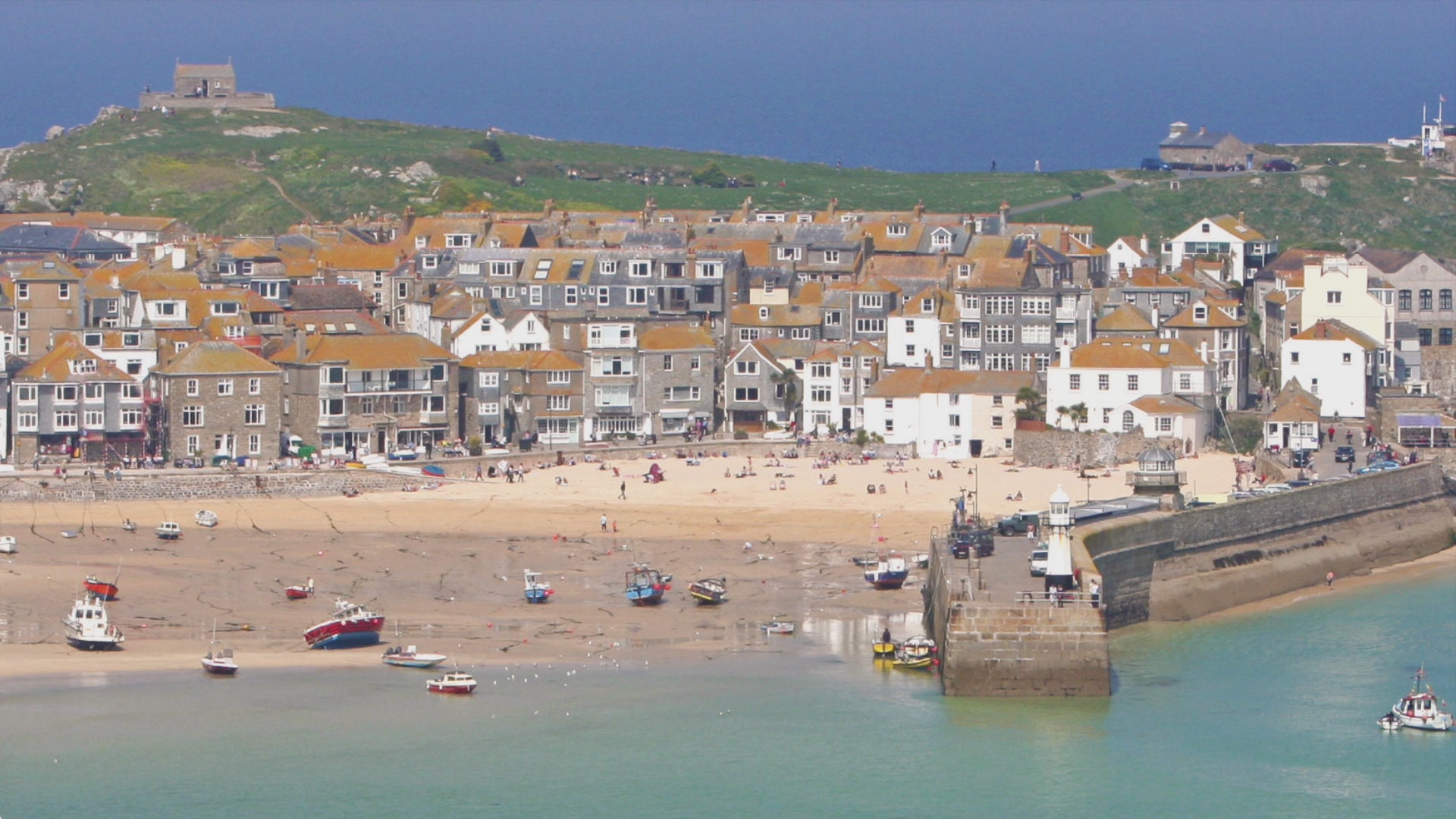 Video animation showing greeting card image of St Ives, with orange roofs, white sands, the harbour and St Ives Island