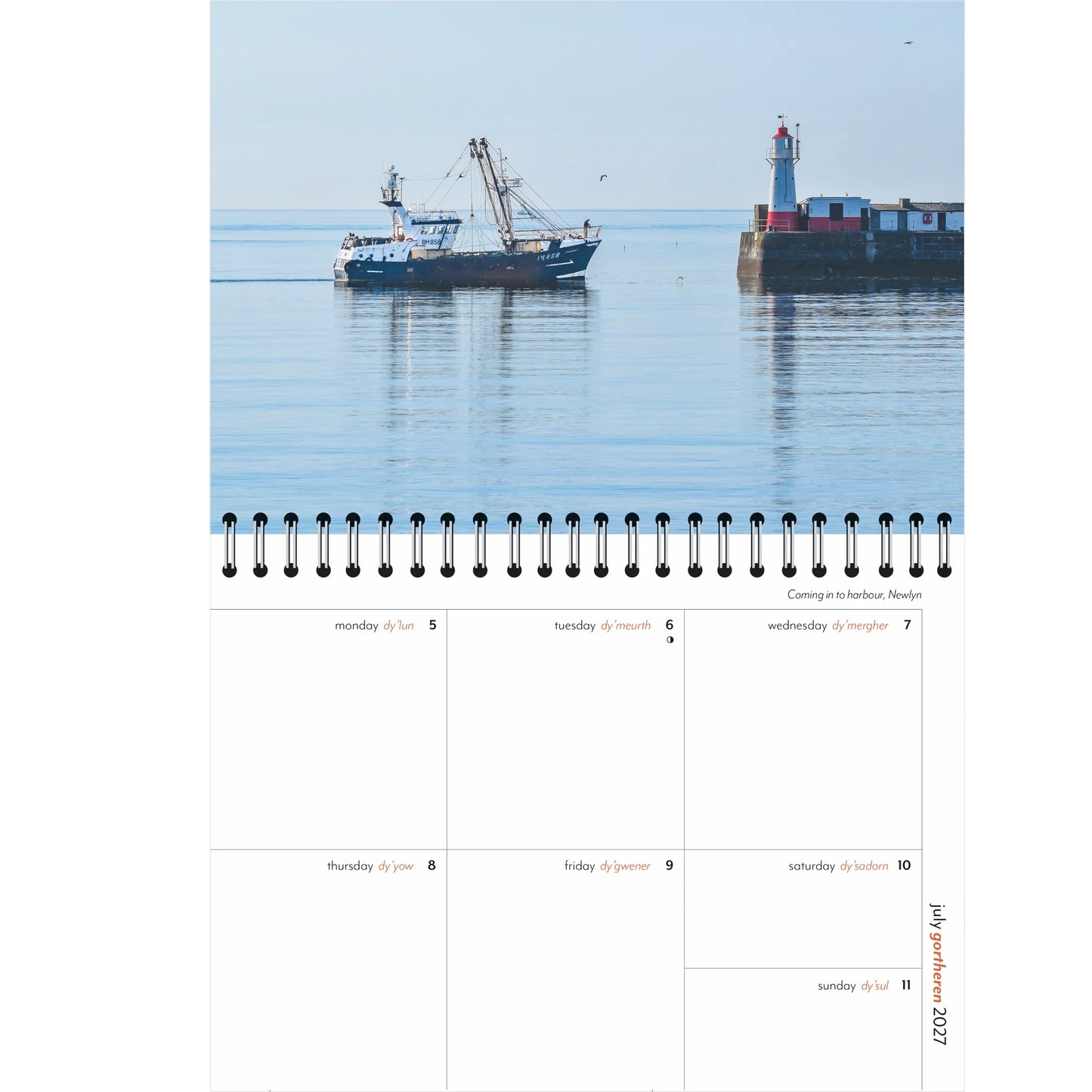A single-page spread from a spiral-bound 2027 weekly diary, featuring a photograph of a fishing boat coming in to Newlyn harbour on a calm water morning, with weekly planning page beneath. 